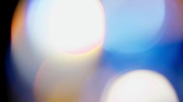 Multicolored light leaks footage on black background. Lens flare leak burst overlays. Natural lighting lamp rays bokeh effect. For compositing over your footage, stylizing , transitions. video