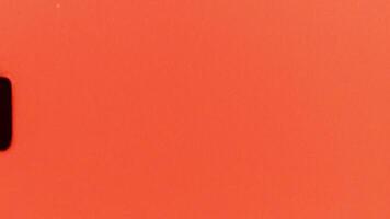 Retro vintage 8 mm film countdown featuring an orange background accented by a black stripe, creating an ideal element for projects seeking an authentic old film aesthetic video