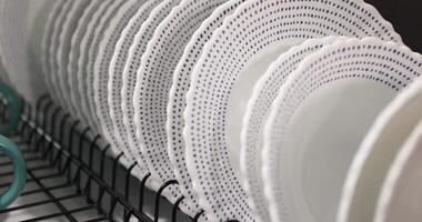 Drying Clean Plates on a Dish Rack in a Cozy Kitchen After Meal Preparation video