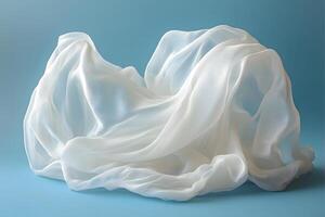 Ethereal Flowing White Fabric on Blue Background for Elegant Design Concepts photo
