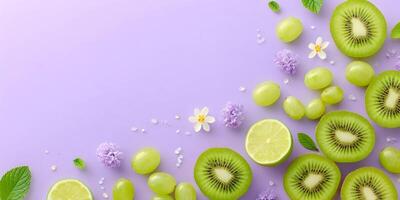 Kiwi Lime Grapes Flowers Flatlay Purple Background photo