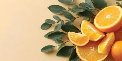 Fresh Orange Slices with Green Leaves on Beige Background photo