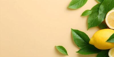 Fresh Lemons with Green Leaves on Beige Background photo