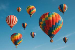 Vibrant hot air balloons soaring in a clear blue sky, a symbol of freedom and adventure photo