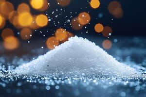 Pile of sugar with water droplets splashing on dark background with bokeh photo