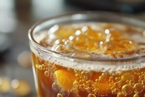 Glass of sparkling cold drink with ice and bubbles refreshing beverage photo