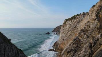 Adraga Beach and Cliffs. Atlantic Ocean, Portugal. Aerial View. Moving Forward Between Cliffs video