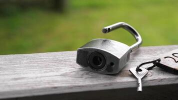 A lock and key on a wooden table video