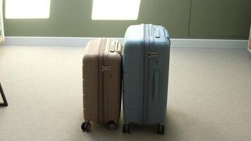 Two suitcases are sitting on the floor video