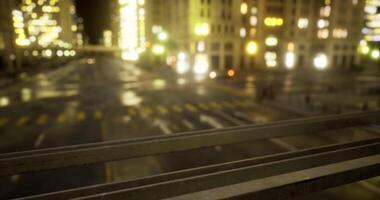 A CGI City street at night with illuminated buildings and wet pavement video