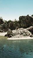 A Photorealistic CGI coastal view of a sand beach with cliffs video