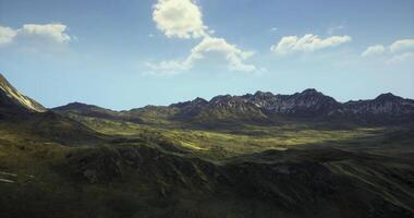 Visualized concept of CGI Majestic mountain landscape under bright blue sky with fluffy clouds video
