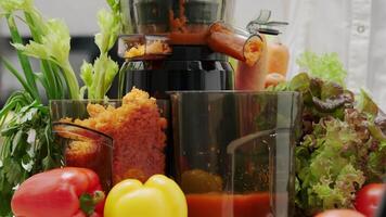 Fresh Vegetable Juicing Process with Colorful Peppers, Celery, and Lettuce in Modern Kitchen Setup video