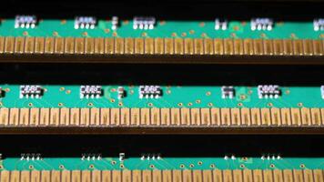 Close-Up View of Green Printed Circuit Boards with Gold Connectors in Electronics Environment video
