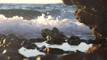 Seashore waves crashing close up, slow motion video