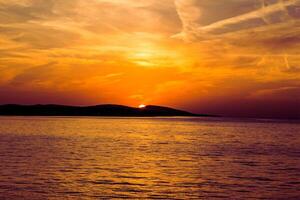 Sunset Inferno Fire Beneath the Clouds photo
