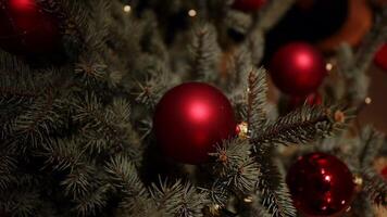 Stunningly Beautiful Red Ornaments Displayed on a Delightful Festive Christmas Tree video