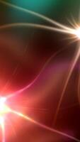 Light streaks glowing and flowing across vibrant gradient background, creating dynamic visual energy with smooth color transitions and luminous movement. video