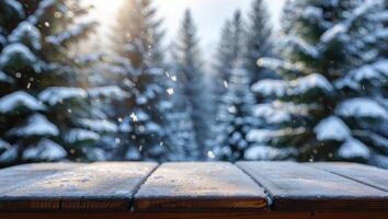 Snowy Wooden Tabletop Overlooking a Blurred Winter Forest with Falling Snowflakes and Soft Sunlight photo