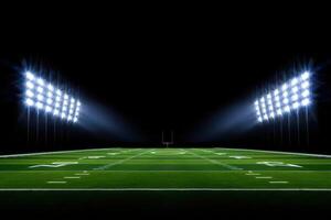Illuminated American Football Field at Night with Bright Stadium Lights and Goal Post in the Distance photo