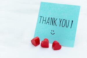 Thank you note with heart decorations home office greeting card calm environment close-up view business appreciation concept photo