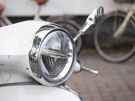 Vintage motorcycle close-up urban setting photography street environment detailed view classic transport aesthetics photo