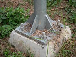 Installation of metal pole base outdoor site infrastructure image natural environment ground level engineering concept photo
