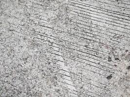 Detailed close-up of textured concrete surface urban environment abstract photography industrial setting minimalist perspective design aesthetic photo