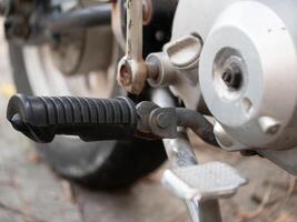 Motorcycle maintenance tips exploring essential components garage instructional guide mechanical environment close-up view motorcycling basics photo