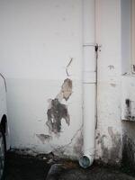 Wall damage repair event residential area structural issue urban environment close-up view home maintenance concept photo