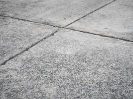Concrete surface patterns urban environment high-resolution image outdoor setting ground level textural details for visual appeal photo