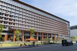 Exploring sustainable modern office building design in urban landscape with open space features photo