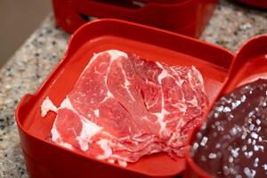 Sizzling meat preparation kitchen counter food photography domestic setting close-up view culinary artistry photo