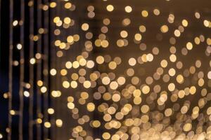 Twinkling lights installation urban setting abstract photography evening atmosphere close-up view capturing festive spirit photo