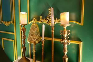 Elegant candle display luxurious room interior decor opulent setting close-up view lighting aesthetic for home ambiance photo