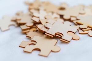 Puzzle pieces representing business strategy development creative workspace educational content collaborative environment close-up view conceptual insight photo