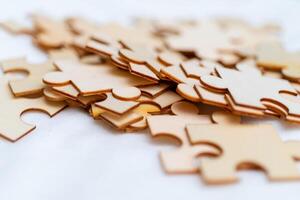 Puzzle pieces scatter on surface business strategy creative mindset indoor workspace close-up view problem-solving concept photo