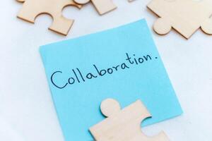 Collaboration in business strategies creative workspace close-up view teamwork concepts blue note emphasizing team spirit photo