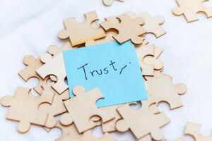 Building trust in business relationships a creative puzzle analogy for team dynamics and collaboration in the workplace photo