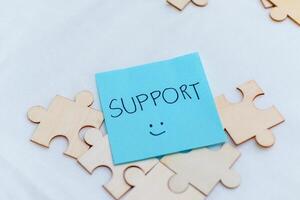 Supportive business environment puzzle pieces of teamwork office space motivational reminder collaborative conceptual thinking photo