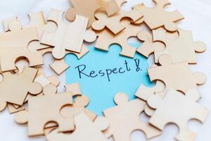 Puzzle pieces of respect in business strategy office conceptual image collaborative environment close-up viewpoint for team building photo