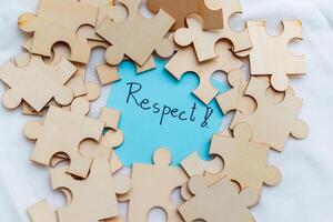 Promoting business values respect through puzzle pieces in a creative workspace indoor setting inspirational concept photo