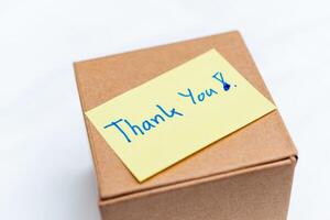 Unboxing gratitude a business package delivery experience home office product presentation minimalist close-up view thankfulness concept photo