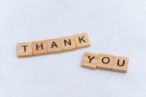Thank you message business context wooden blocks minimalist setup close perspective appreciation concept for enhanced engagement photo