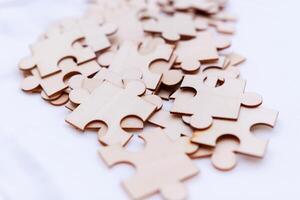 Strategizing business growth puzzle pieces on a table home office digital content calm environment creative viewpoint problem-solving concept photo