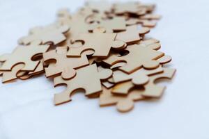 Puzzle pieces for business strategy development office space visual content creative environment close-up problem-solving concept photo