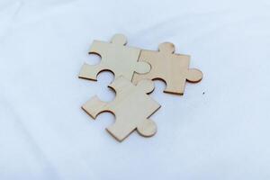 Strategic business collaboration puzzle pieces representing teamwork modern office visual content professional environment close-up view problem-solving concept photo