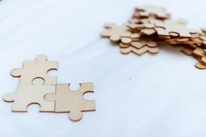 Business insights assembling creative strategies with wooden puzzle pieces home office visual content collaborative environment focused concept photo