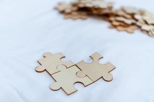 Strategic business solutions office workspace puzzle pieces minimalist environment close-up view problem-solving concept photo