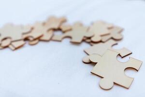 Puzzle pieces representing business strategy workspace visual concept engaging environment close-up collaboration and problem solving photo